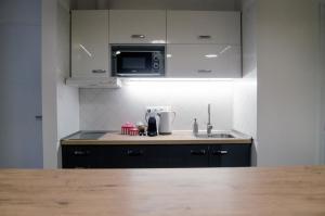 Kuchyňa alebo kuchynka v ubytovaní Pacman Apartment