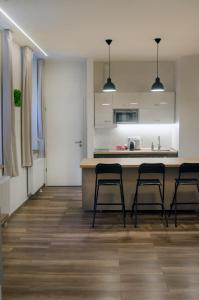 Kuchyňa alebo kuchynka v ubytovaní Pacman Apartment