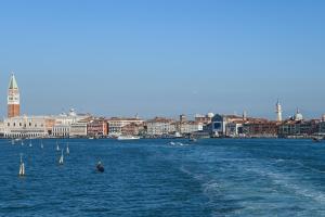 a large body of water with a city in the background at A Tribute To Music Residenza in Venice
