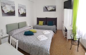 Postel nebo postele na pokoji v ubytování Rose Antiche Vatican B&B