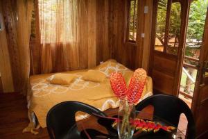 Llit o llits en una habitació de GUEST HOUSE QUINTA NATURAL Bangalots