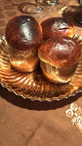 two loaves of bread on a plate on a table at Top House Murat con idromassaggio in Bari