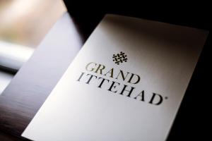 a white card with the words grandfield on it at Grand Ittehad Boutique Hotel in Lahore