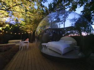 Voodi või voodid majutusasutuse Atmosfera Bubble Glamping toas