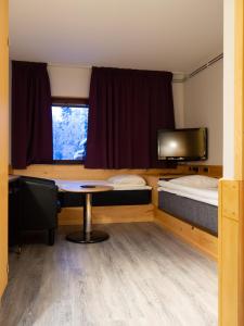 Säng eller sängar i ett rum på Hotell Toppen