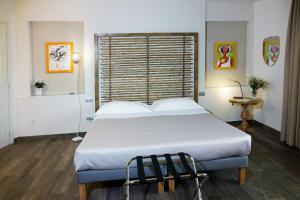 a bedroom with a large bed in a room at La corte di Bafè B&B "Slow Life" in Zafferana Etnea +40 photos