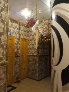 a hallway in a house with christmas decorations at Guest House Geralda on Nevskiy in Saint Petersburg