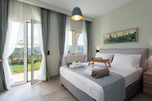 Posteľ alebo postele v izbe v ubytovaní Ionian Sun + 37 fotografií
