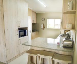 Kuchyň nebo kuchyňský kout v ubytování Settle inn Self Catering Units