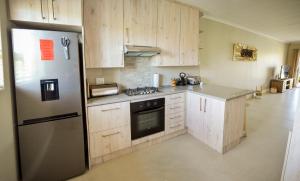 Kuchyň nebo kuchyňský kout v ubytování Settle inn Self Catering Units