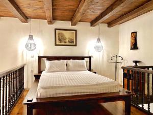 Postel nebo postele na pokoji v ubytování Boutique Hotel Del Doge