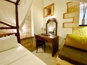 Postel nebo postele na pokoji v ubytování Boutique Hotel Del Doge