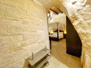 Postel nebo postele na pokoji v ubytování Boutique Hotel Del Doge
