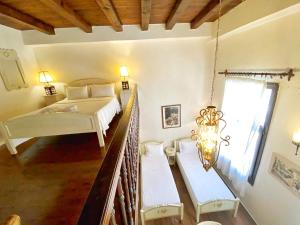 Postel nebo postele na pokoji v ubytování Boutique Hotel Del Doge