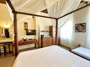 Postel nebo postele na pokoji v ubytování Boutique Hotel Del Doge