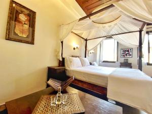Postel nebo postele na pokoji v ubytování Boutique Hotel Del Doge