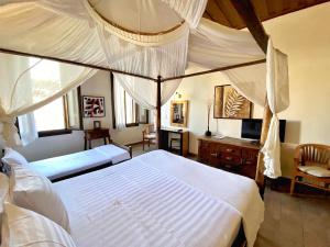 Postel nebo postele na pokoji v ubytování Boutique Hotel Del Doge