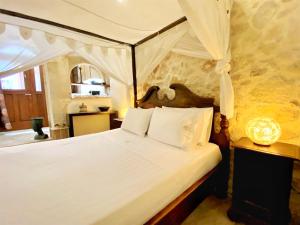 Postel nebo postele na pokoji v ubytování Boutique Hotel Del Doge