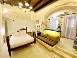 Postel nebo postele na pokoji v ubytování Boutique Hotel Del Doge