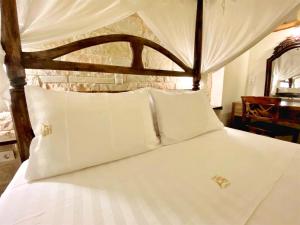 Postel nebo postele na pokoji v ubytování Boutique Hotel Del Doge