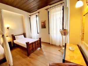Postel nebo postele na pokoji v ubytování Boutique Hotel Del Doge