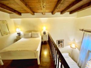 Postel nebo postele na pokoji v ubytování Boutique Hotel Del Doge