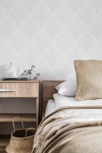 Posteľ alebo postele v izbe v ubytovaní Apartamenty pod Orłem - Rezydencja do Skoczni