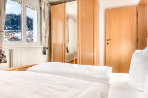 Posteľ alebo postele v izbe v ubytovaní Haus Capricorn - Garten Appartement