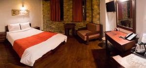 Ένα ή περισσότερα κρεβάτια σε δωμάτιο στο Villa Vadola