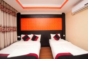 Voodi või voodid majutusasutuse Kathmandu Regency Hotel toas