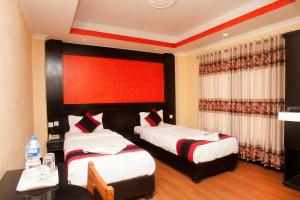 Voodi või voodid majutusasutuse Kathmandu Regency Hotel toas