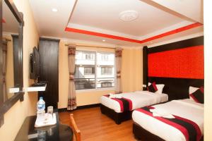 Voodi või voodid majutusasutuse Kathmandu Regency Hotel toas