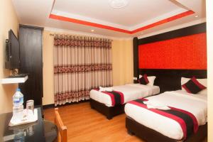 Voodi või voodid majutusasutuse Kathmandu Regency Hotel toas