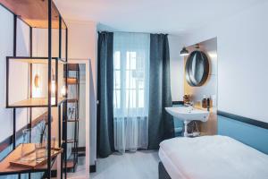 Rúm í herbergi á Pop Up Hotel Krone Zürich