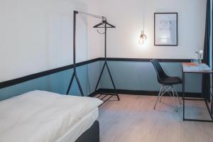 Rúm í herbergi á Pop Up Hotel Krone Zürich