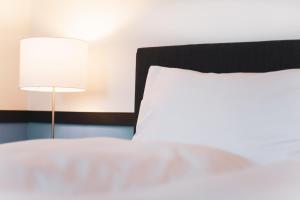 Rúm í herbergi á Pop Up Hotel Krone Zürich