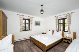 Postel nebo postele na pokoji v ubytování Penzion Pod Sudem