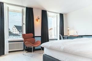 Postel nebo postele na pokoji v ubytování Pop Up Hotel Krone Zürich