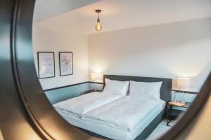 Rúm í herbergi á Pop Up Hotel Krone Zürich