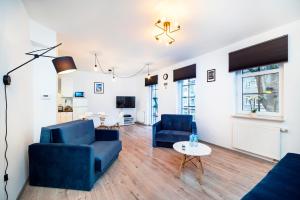 Telewizja i/lub zestaw kina domowego w obiekcie Apartment Zamojska 8 - Apartamenty GKM Lublin