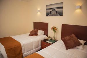 Cama ou camas em um quarto em Hotel Ferrua