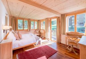 Postel nebo postele na pokoji v ubytování Chalet Luna