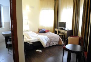 Letto o letti in una camera di Gullo Hotel
