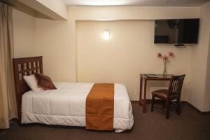 Cama ou camas em um quarto em Hotel Ferrua