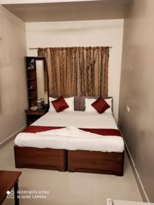 Ένα ή περισσότερα κρεβάτια σε δωμάτιο στο Hotel I-Way Residency Perungudi
