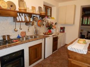 a kitchen with a sink and a counter top at La Capannella in Gallicano