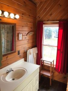 a bathroom with a sink and a window at West Quoddy Station LLC in Lubec