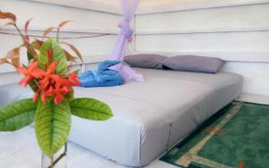 En eller flere senge i et værelse på Yez Yez Yez All Good Hostel
