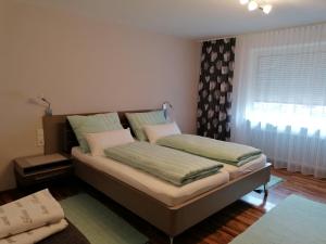 Posteľ alebo postele v izbe v ubytovaní Apartment GINA