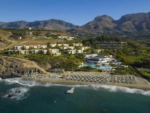 an aerial view of a beach with a resort at Zefyros Studios in Damnoni